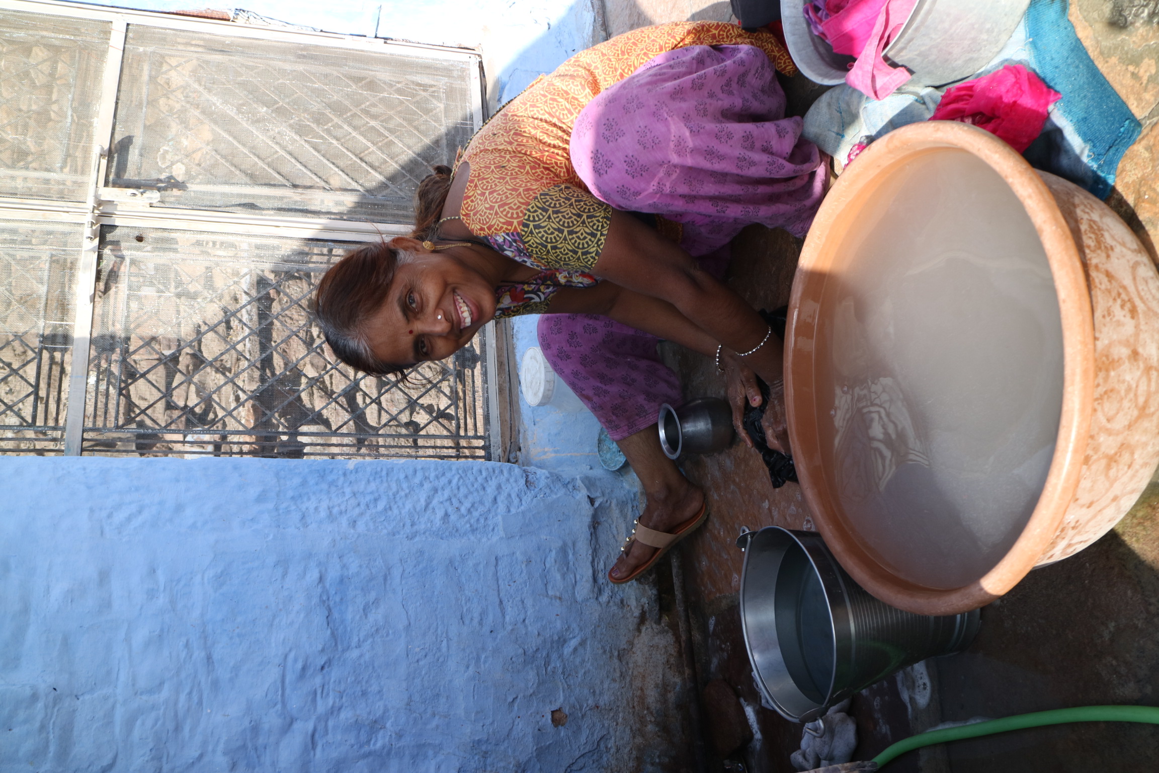 Undertaking laundry day in the heat of the Rajasthan desert, Jodhpur. Finding shade is scarce yet smiles everywhere. 