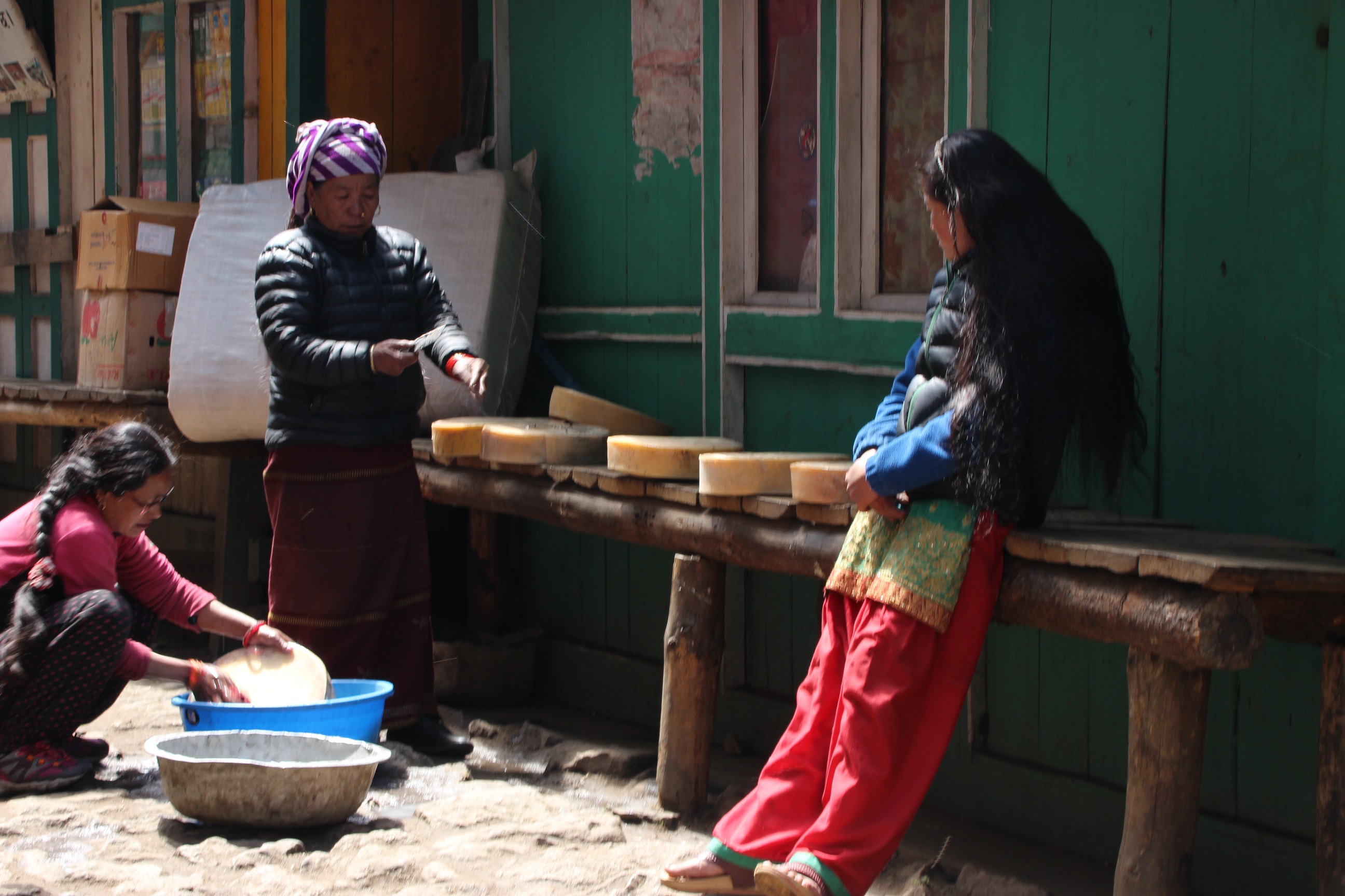 Often when referencing Sherpa, the focus tend to be on men. However, women also remain active taking care of their households but also bringing income from local produce such as yak cheese: forming, cutting and washing the final product before it can be sold. 