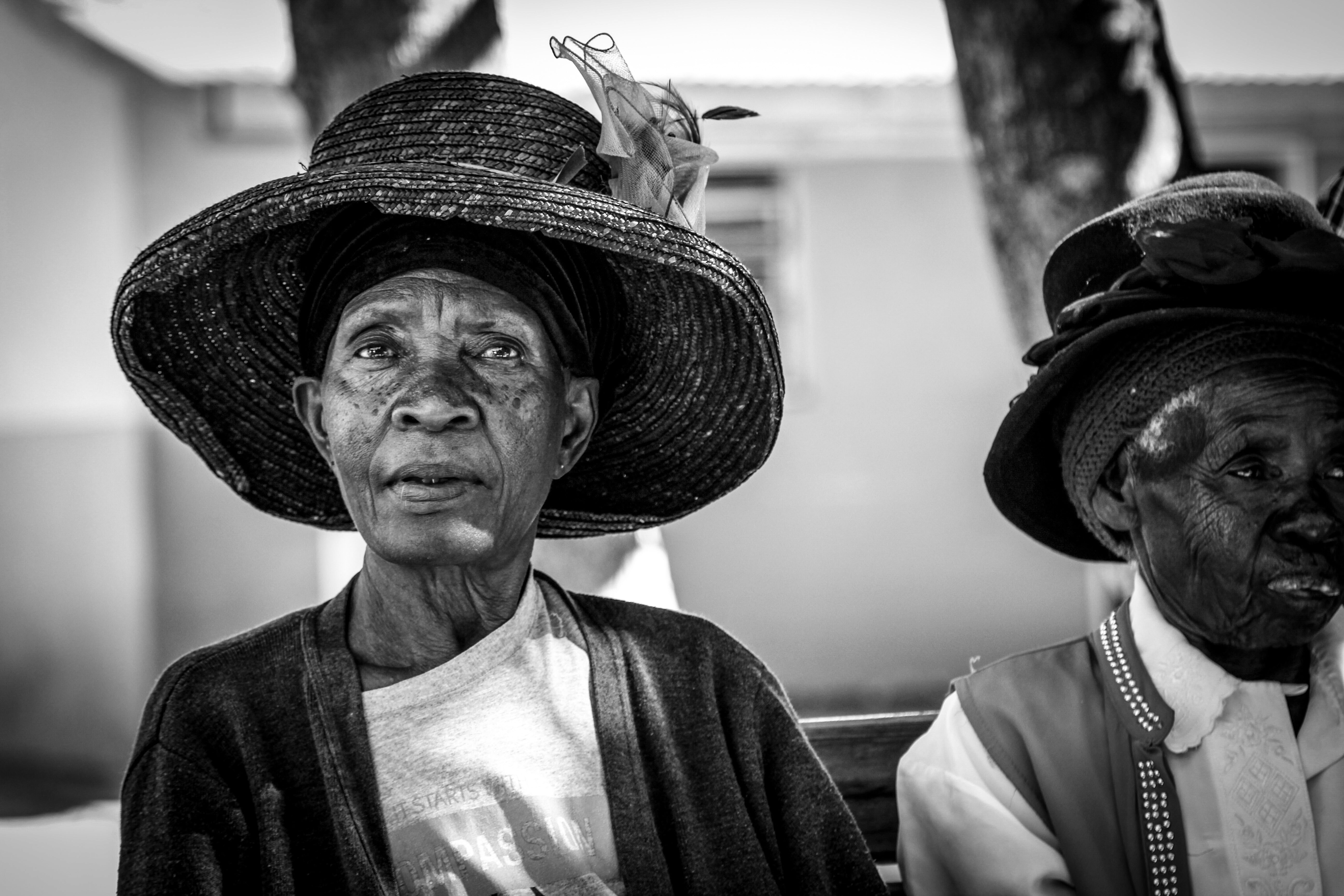 In a senior center near Luanshya an old lady is intrigued by our presence. Her eyes are proud, fixed and curious, and she seems to tell us something. Luanshya, Zambia July 2019.