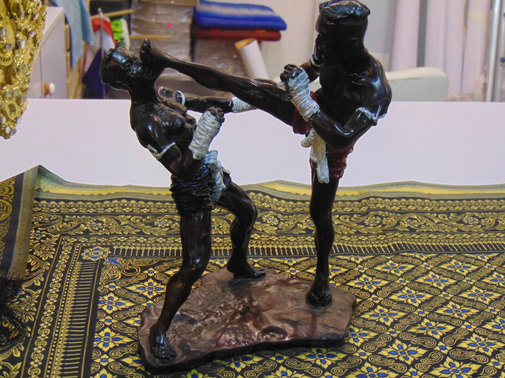 " In the gut"
Artwork of a man performing a crane kick on his opponent
Not literally, this phrase expresses the pain affiliated with a crane kick.