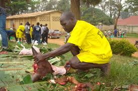 Okello Mike inmate at Kampala Remand prison helping staffs to slaughter cow for weekend.Mostly our staffs are given cows to slaughter every month.