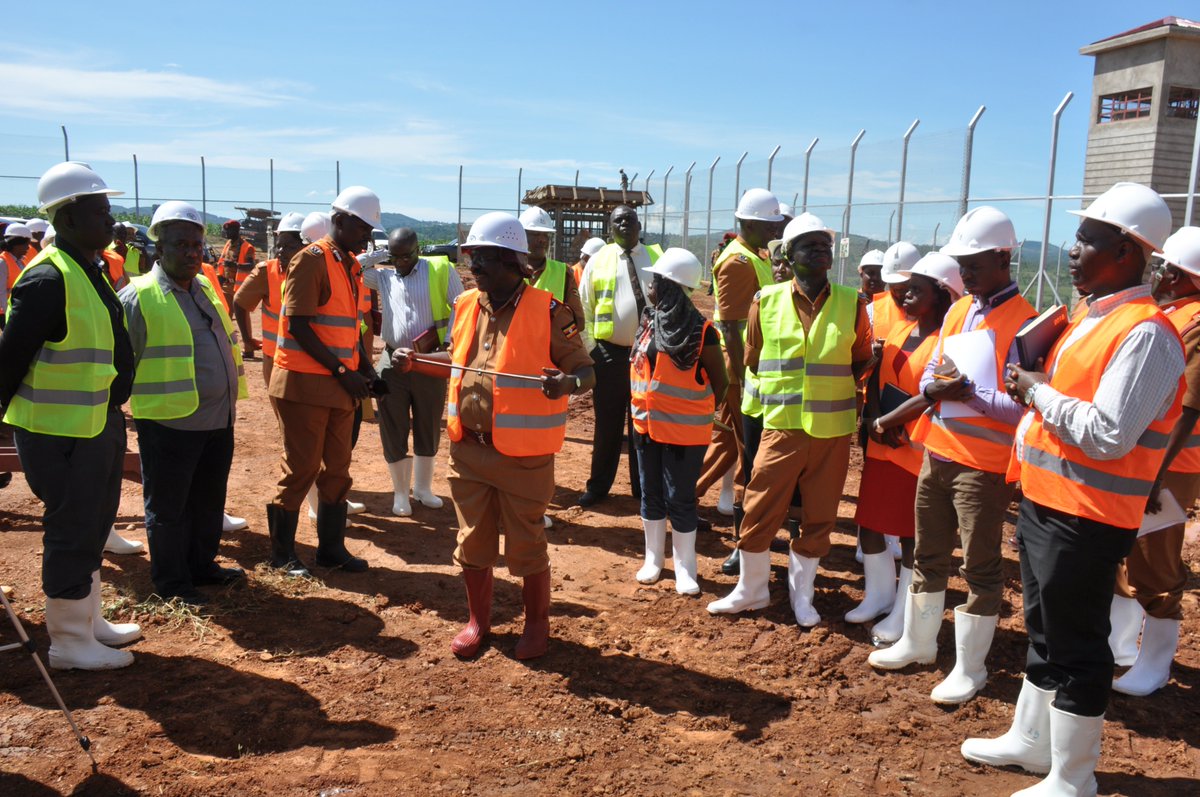 Uganda prisons services build a new mini-max prison in Kitalya Wakiso district  that will help and reduce the over population of inmates in different part of Uganda. Dr. Johnson Byabashaija the commissioner General with the officers and constructors at the site.