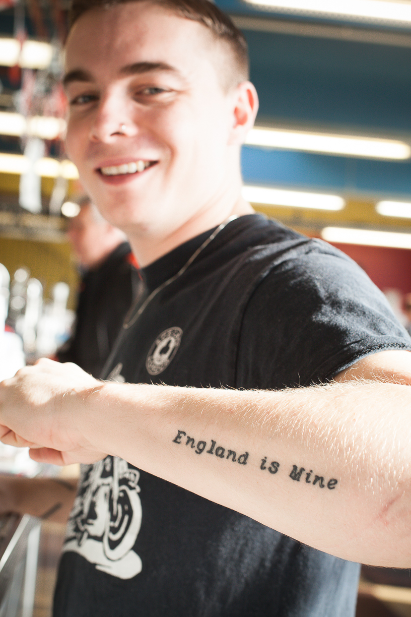 'England is Mine.' The waiter wouldn't stand for a portrait until I asked if he would at least let me take a picture of his tattoo, at which point he smiled and posed. This tattoo could be interpreted in a lot of ways. It struck me that it could be both political and/or a motivational motto. 