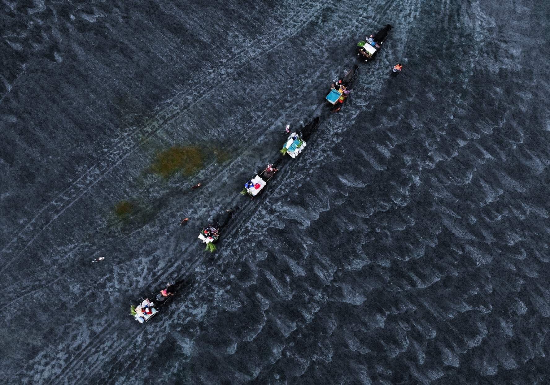 The view from above of people travel inline to cross the river of Botolan Zambales in the Philippines.