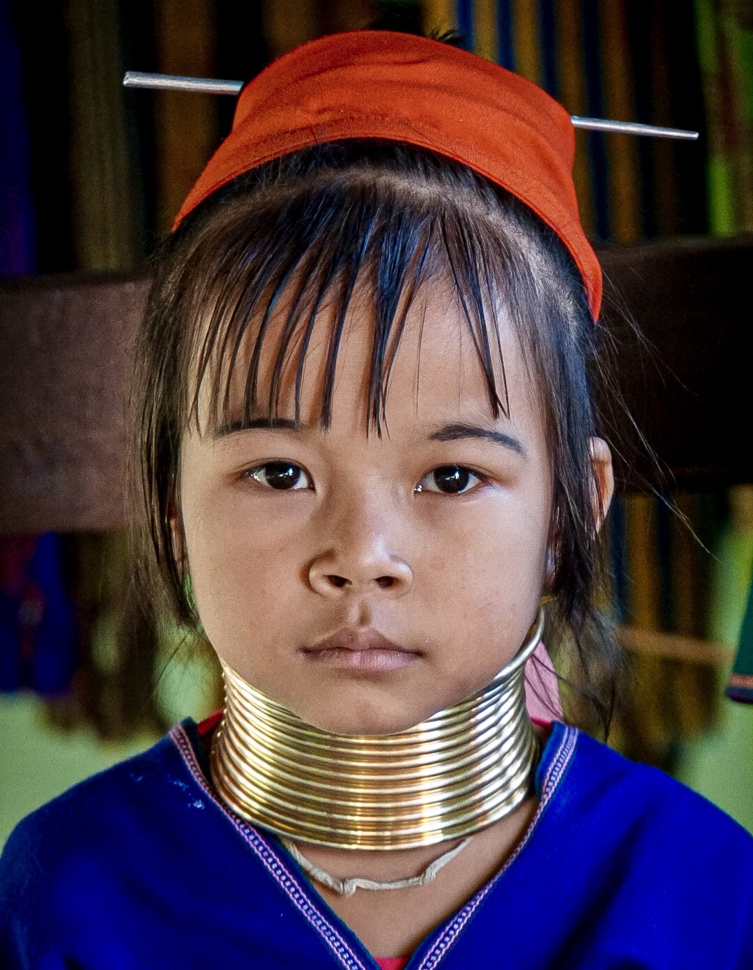 Padaung Long Neck Girl:
Padaung is a Shan term for the subgroup, Kayan Lahwi in which women wear this brass neck coils as part of their tradition. 