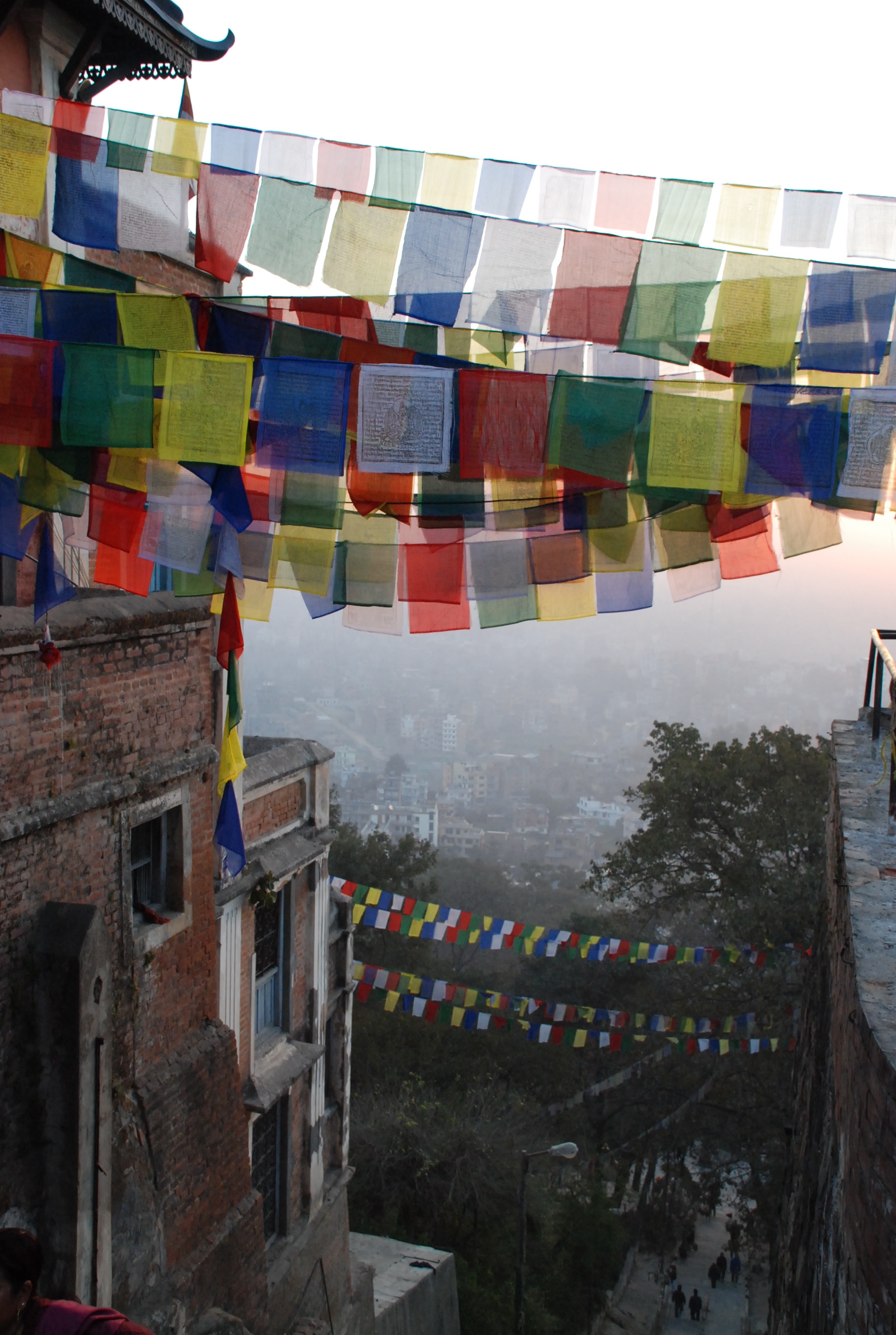 Each morning at dawn, pilgrims, visitors, and tourists arrive at Swayambhunath; an ancient Buddhist temple located in the Kathmandu Valley, Nepal. Those with strong legs climb the steep stone steps to the summit.