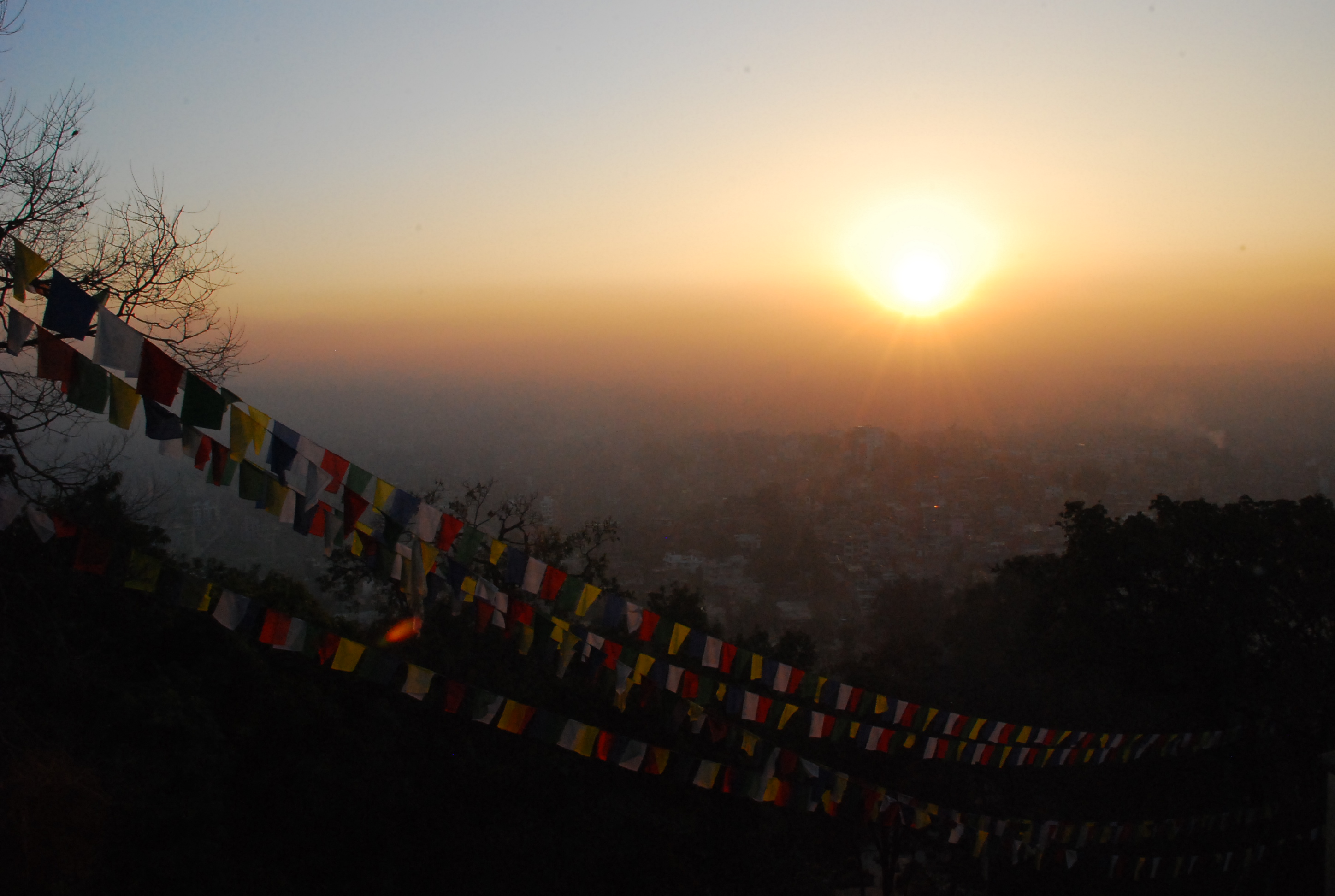 Prayer flags adorn Swayambhunath. Tibetan Buddhists believe they impart mantras and blessings on the wind, spreading love and good-will to all. From the vantage point of Swayambhunath, Kathmandu is spread out below and sunrise prayers are carried on the breeze to its inhabitants.