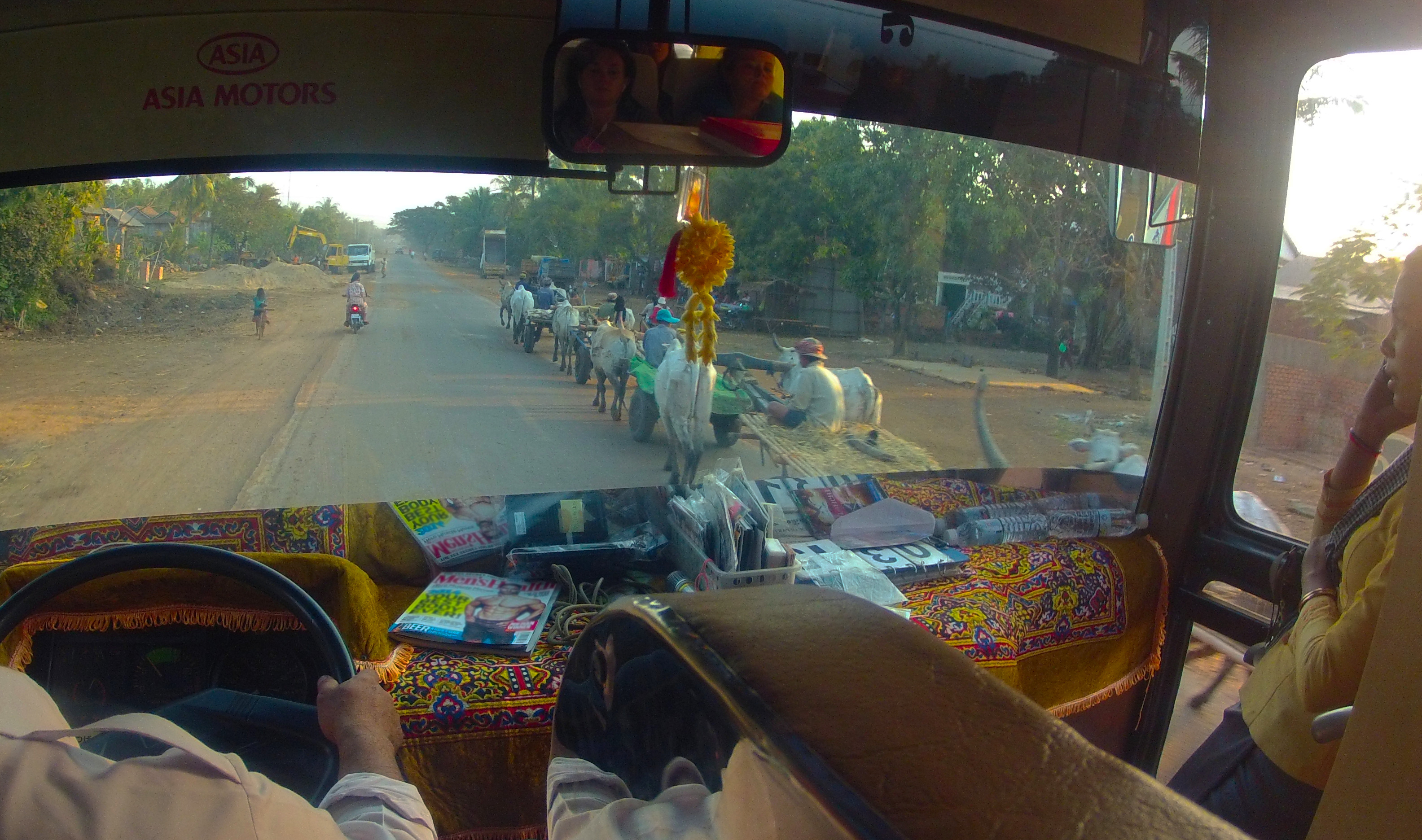 Many hours are spent travelling along bumby, uneven roads commonly referred as the "Cambodian Massage". As new highways are being constructed the driver has to share the roads with ox-driven caravans and motorbikes.
