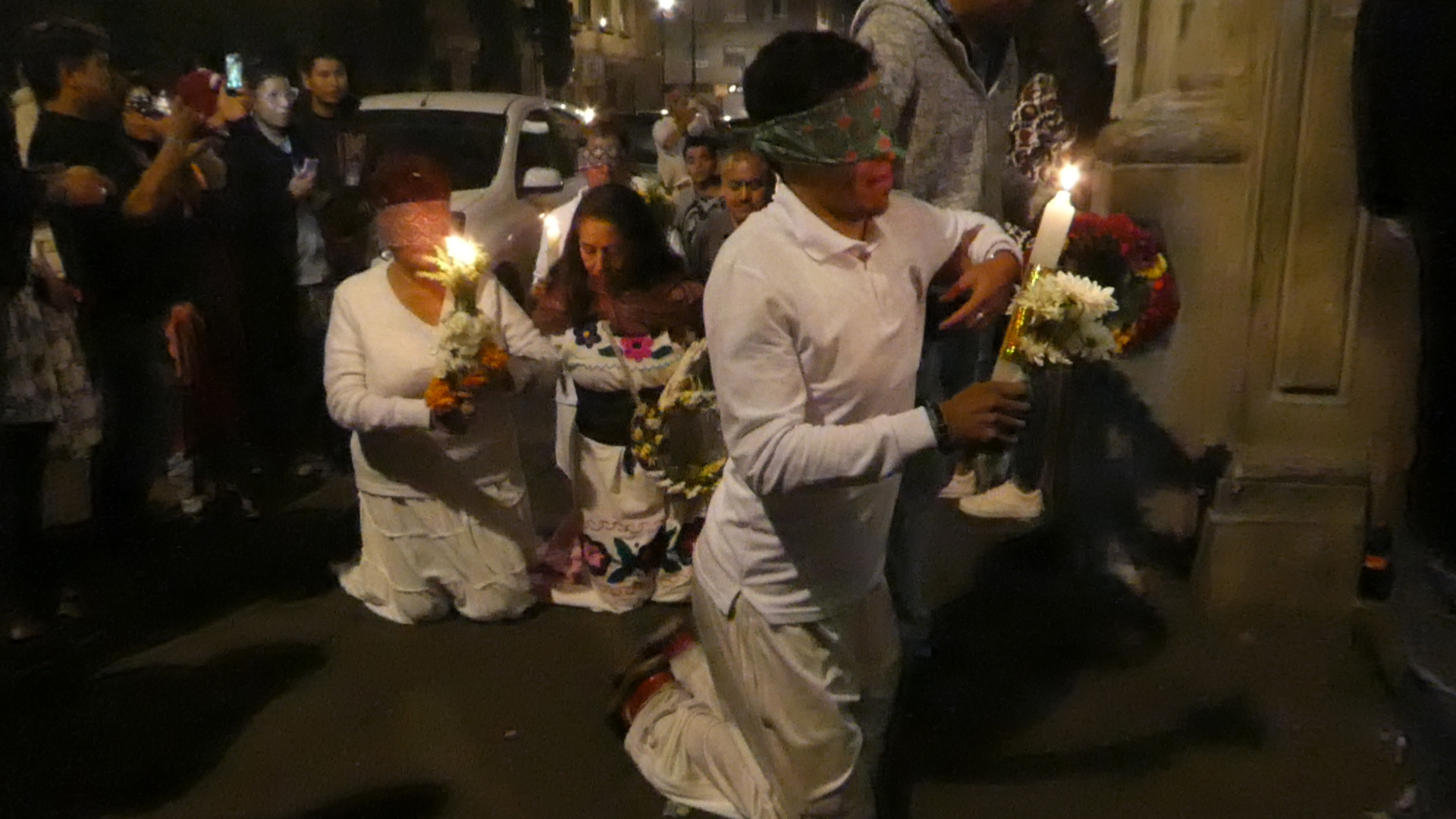 Following sounds of singing & prayers led down a dark alley towards a tiny church that glowed with candlelight reflecting off the mosaics. Stepping out of the incense fill Catholics sanctuary I caught a different type of Día de Muertos procession. One sacred to the pre-Columbian cult of Santa Muerte