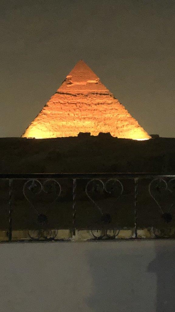 Night and the light show begins. We don't have to move from our balcony and have stared out at the changing perspectives of the great pyramids all day now. We don't to join the tourists and the tour buses and we don't want to ever leave this room. It's like a sea view - ever changing. 