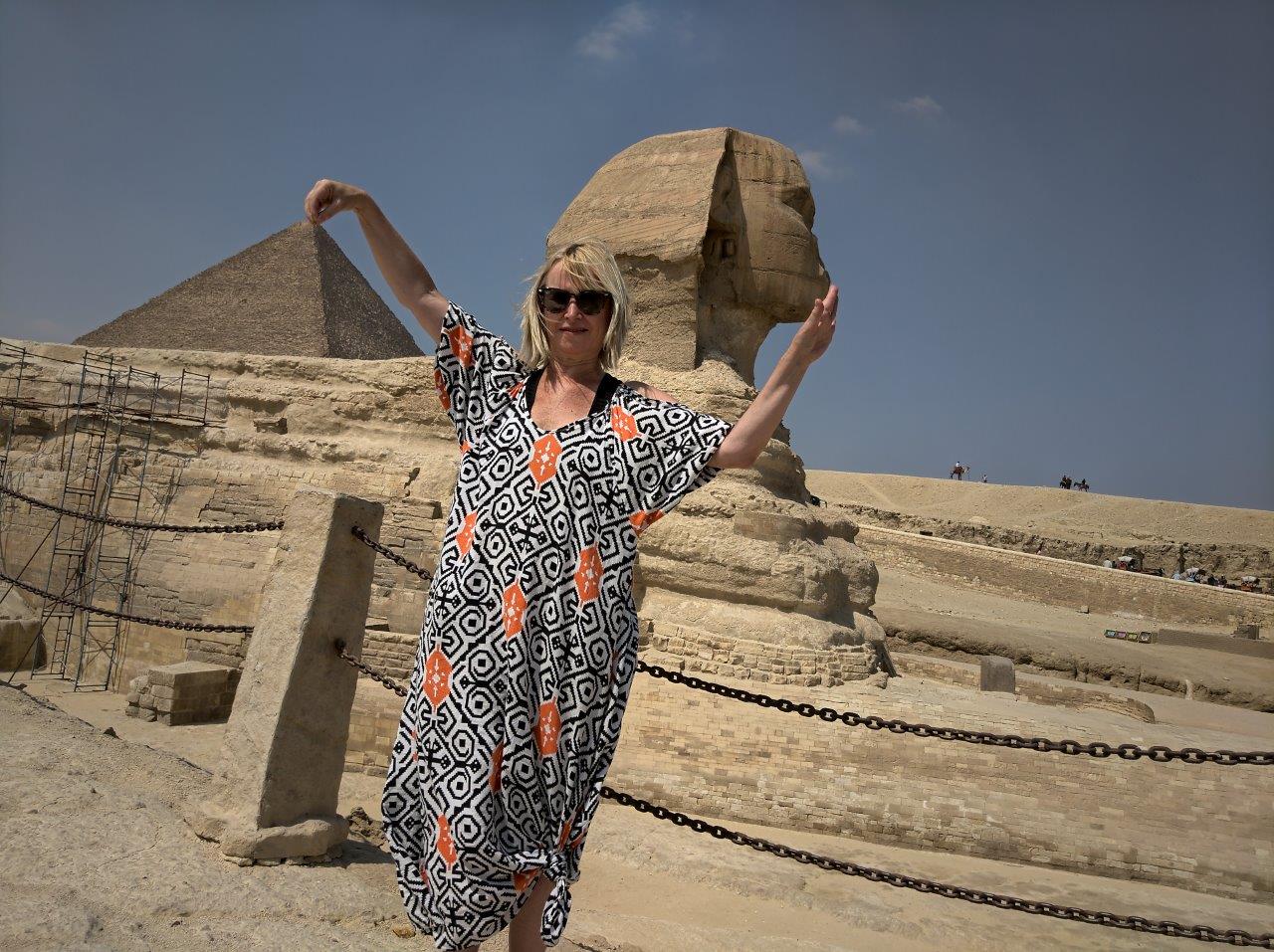 I know, I know, I know. This is cheesy - this is what tourists should never do. This is dumb - BUT you know what. It's Egypt. It's a POSTCARD from the Pyramids. 