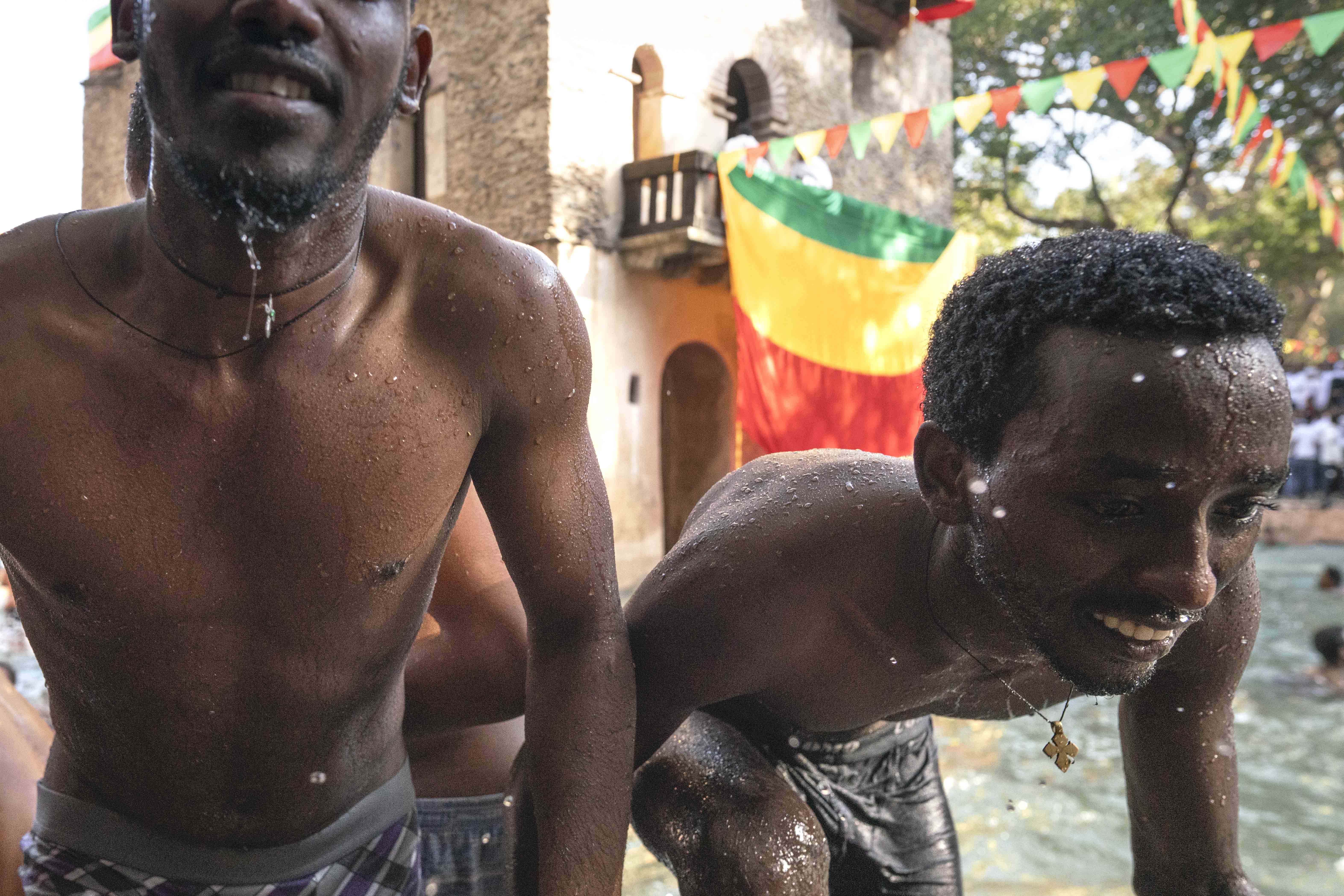 Once the water is blessed, the atmosphere is completely inverted! What was a quiet, thoughtful ceremony becomes an exuberant watery celebration as many young (mostly) men jump into the water to renew their baptism vows