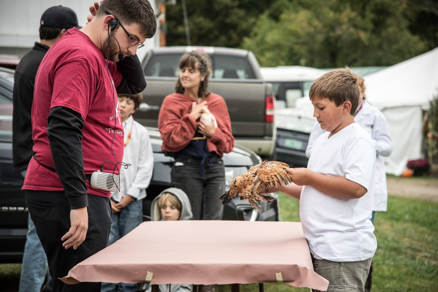 A young boy has his poultry judged at the competition