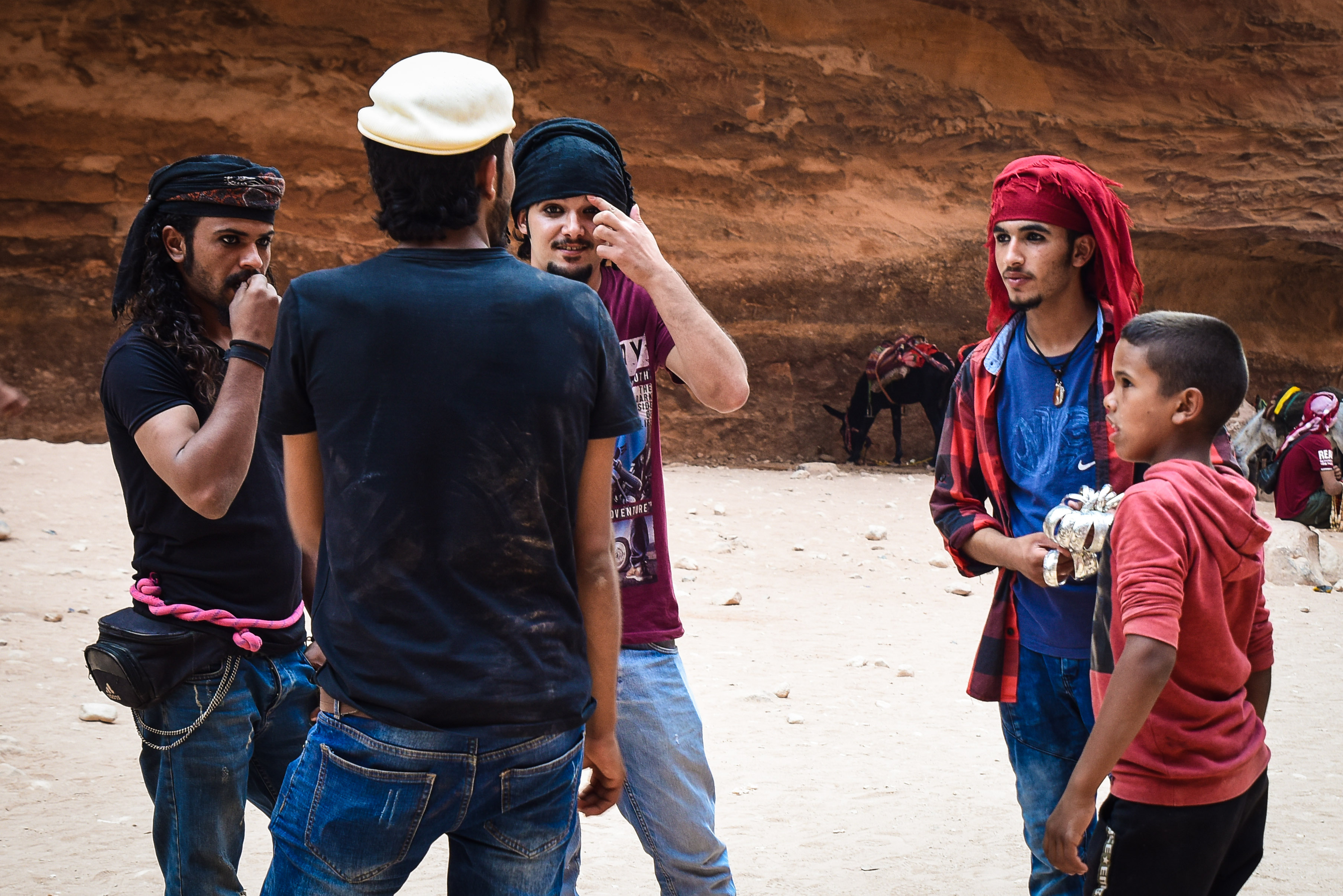A group of Bedouin men and boys gather at the end of a long day of work in Petra.