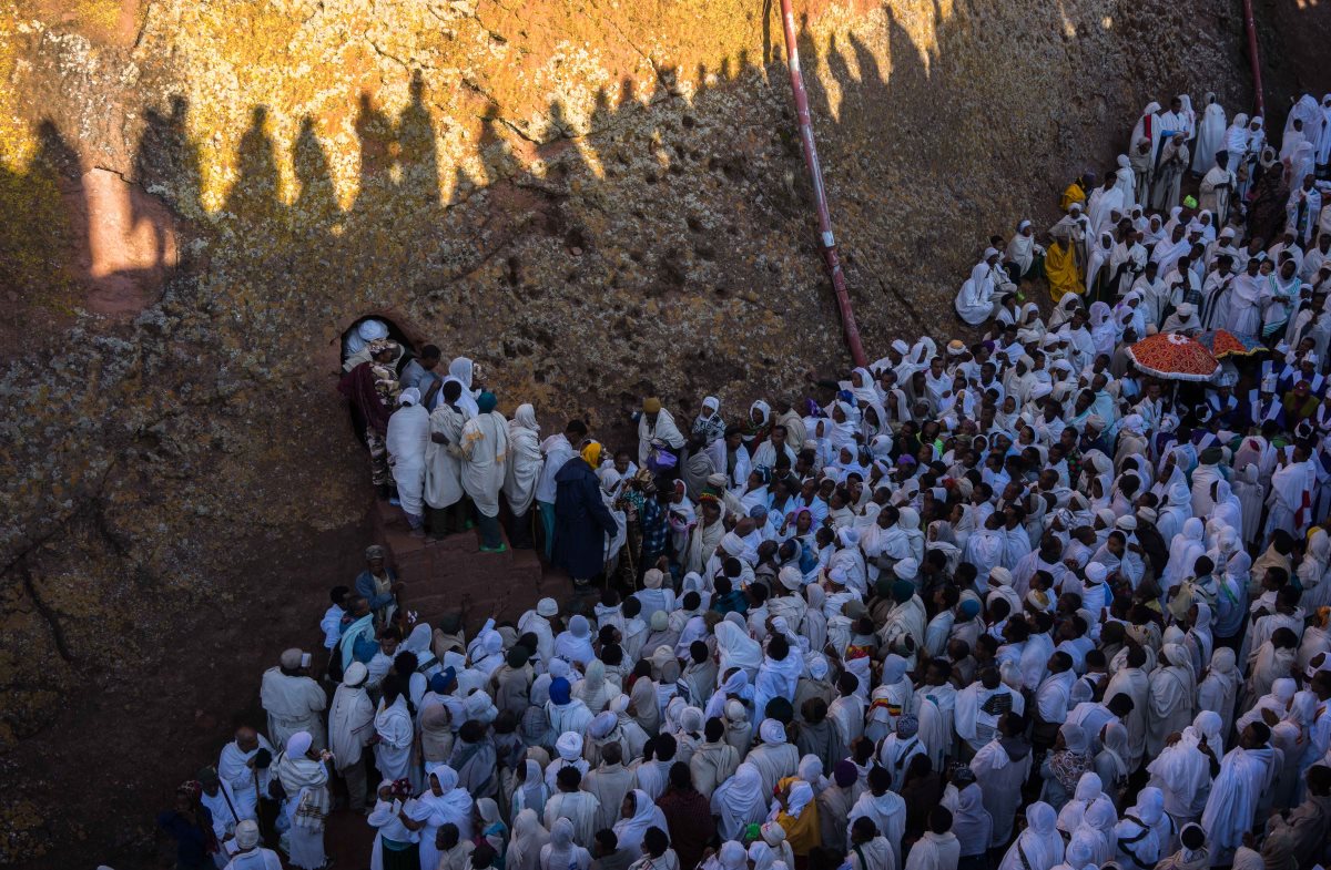 Every year, thousands of people gather on Christmas Day to pay homage in Lalibela, Ethiopia's most holy city. Here, pilgrims prepare to enter one of Lalibela's many rock-hewn churches built in the 12th century as a 'New Jerusalem' after the Muslim Conquest hindered Christians' passage to the Holy Land.