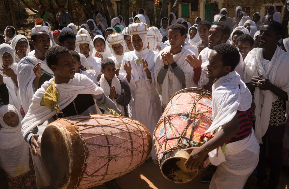 Devotees gather to dance and sing songs of praise following a church ceremony.