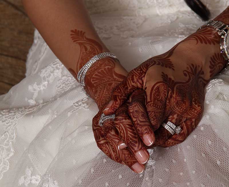 The bride's hennaed hands.