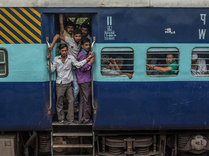 An Indian train filled to capacity.