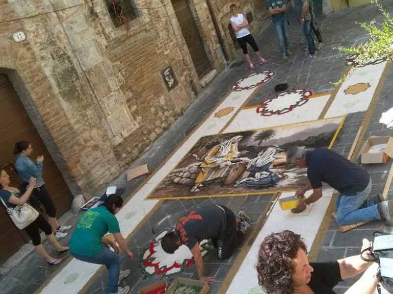 San Gemini locals create floral tapestries in the streets of the town.