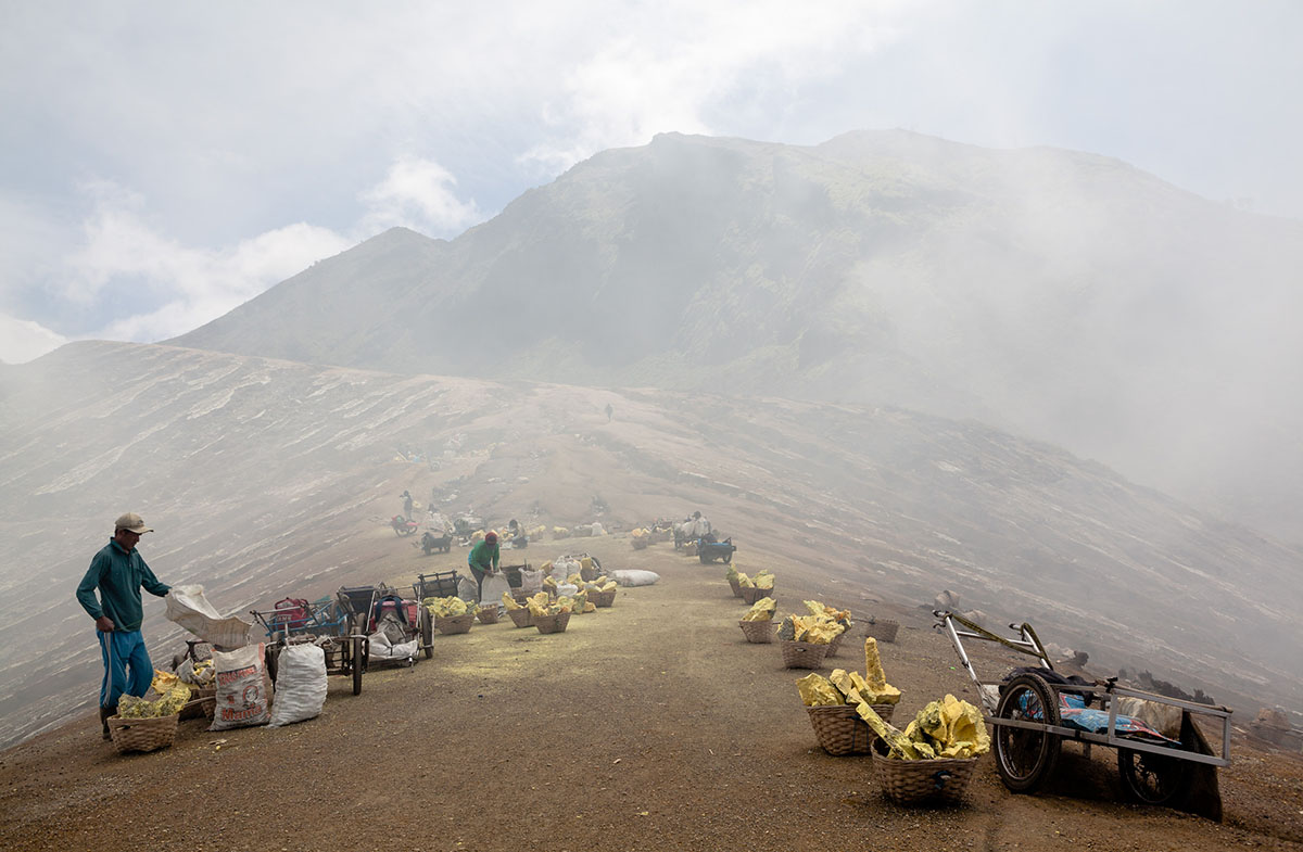 The peak of Kawah Ijen. This is where the miners’ suffering ends – temporarily. From here, the loads of sulfur are carried down the slope on two-wheeled hand carts. The miners make the exhausting trip twice a day, for very little money.