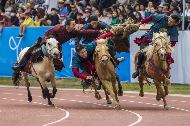 From the opening ceremony: a reenactment of a game Mongolians play out on the steppe.