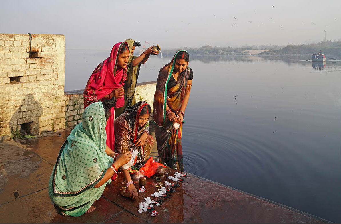 On the auspicious occasion of Makar Sankranti, the Hindu New year, women perform the festival rituals after taking a dip in the river at the banks in Delhi. All orthodox devotees have continued these traditions for ages, despite the river’s grim conditions.