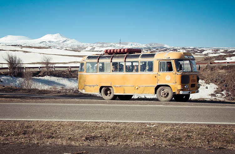 Old fashioned yellow bus in Gegharkunik province, Armenia