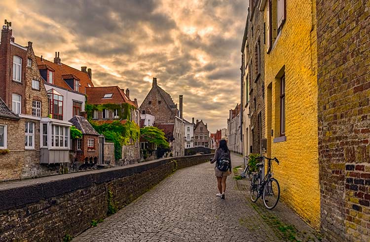 Woman walking alone in Bruges