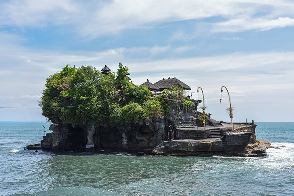 An island with buildings on it, surrounded by water in Indonesia