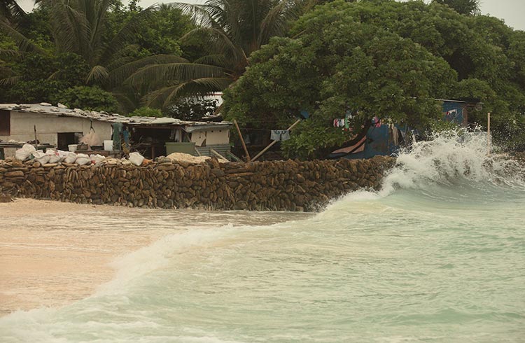 A wave crashing on Kirtibati, Tararwa island