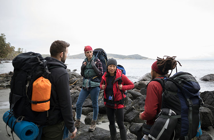 A group of backpackers near a beach