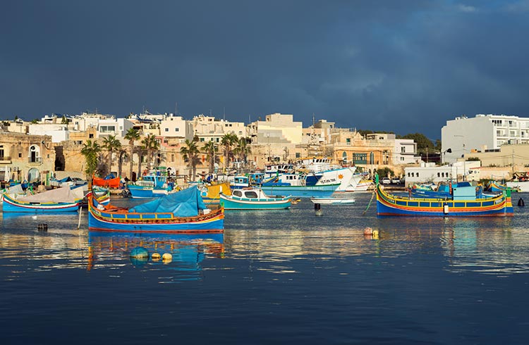 Gloomy sky over the fishing village Marsaxlokk, Malta