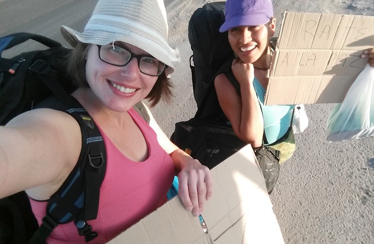 Two women hitchhiking in Baja California Sur, Mexico.