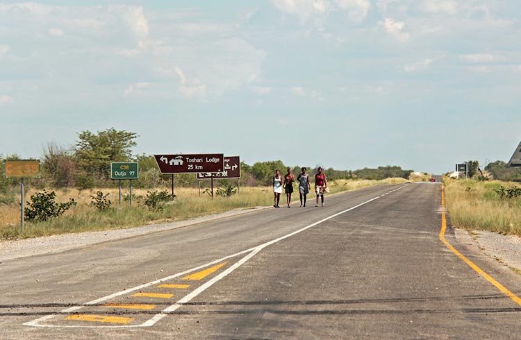 People walking along a road in Namibia
