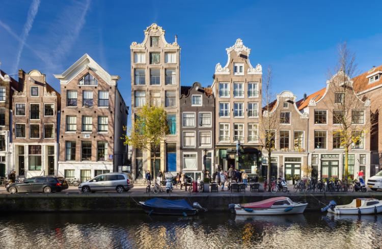 Dutch-style houses along a canal in Amsterdam, the Netherlands.