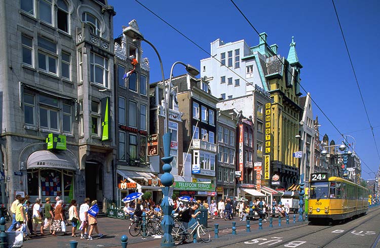 Tram traffic on the Damrak, Amsterdam, Holland