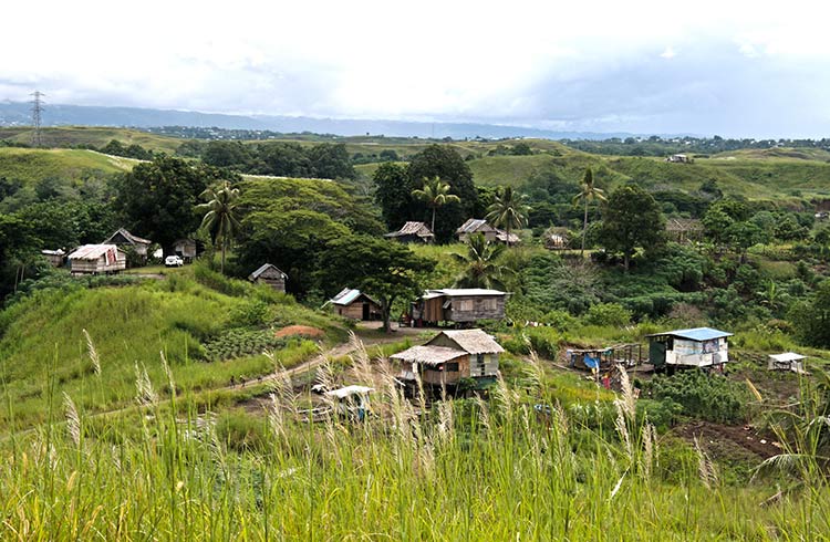 A small village on grassy hills in Guadalcanal's mainland of Solomon Islands