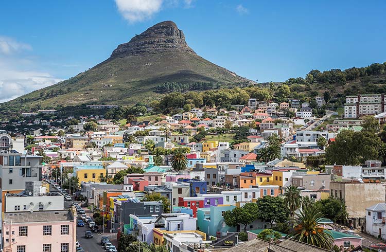 Colorful houses at the bottom of the mountain in Cape Town, South Africa