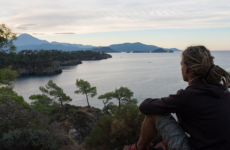 Admiring the view of the Aegean sea at dusk in a quiet and beautiful place near Fethiye, South-West Turkey