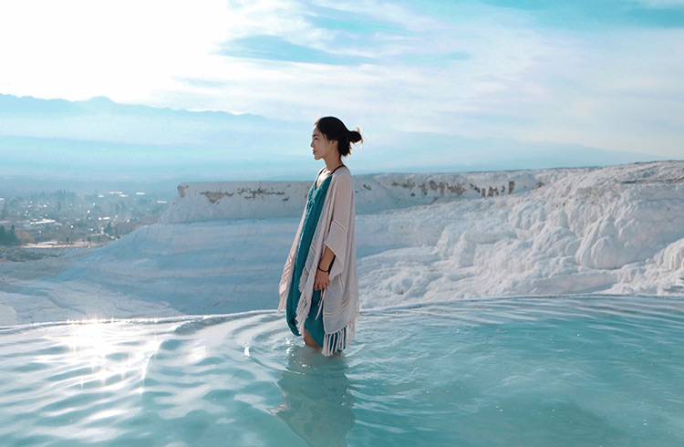 A woman stands in the water at Pamukkale, Turkey