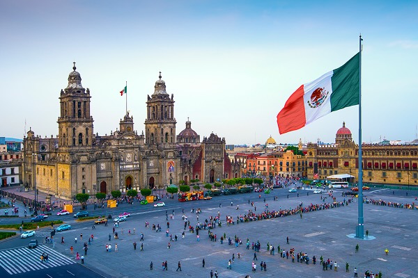 The Mexican flag flies over the Zocalo, the main square in Mexico City