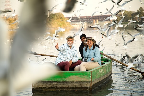 A family in a boat floating down a river