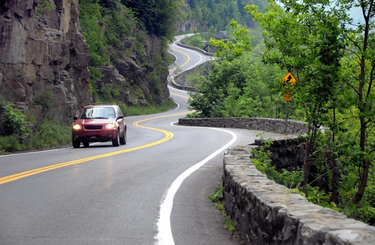 A car drives along a curvy road in New Jersey, USA.