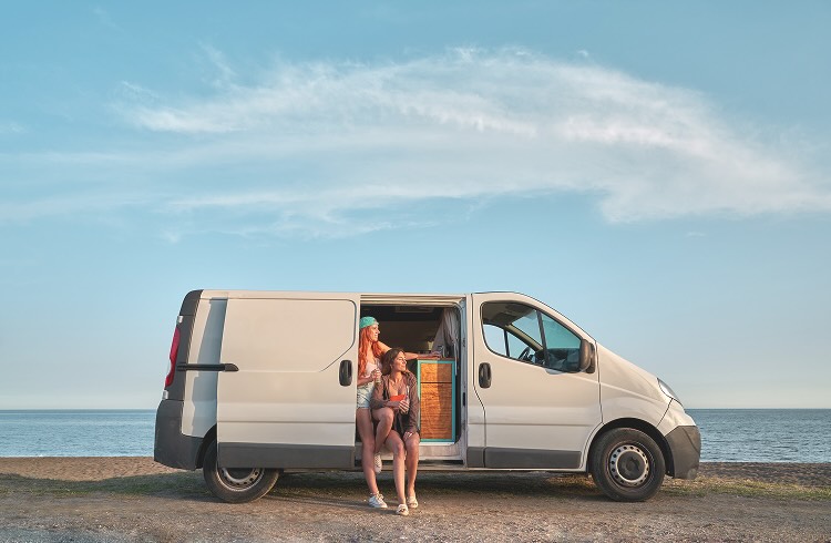 Two women in a van door