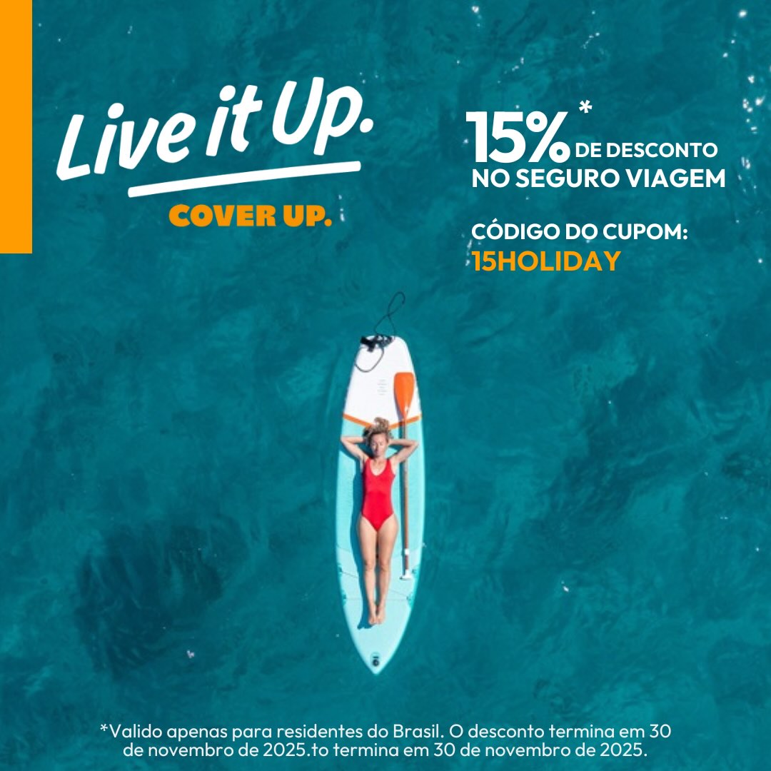 A woman standing on a hill looking over a view