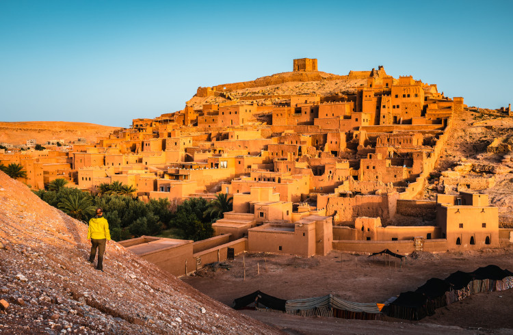 Tourist at Ait Benhaddou at sunrise, Morocco